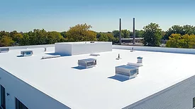 White two-story flat roof commercial building. 