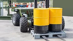 Transportation and loading of chemicals in yellow barrels